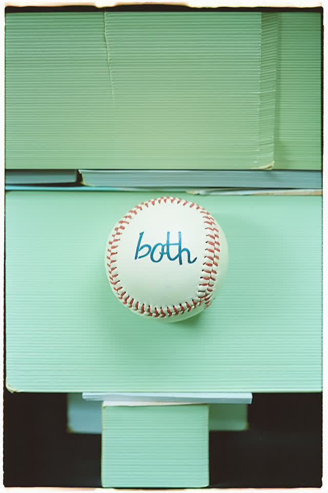 A surreal but emotionally coherent tableau shaped by baseball, both, callsign, with visual cues of stacked journals, pre