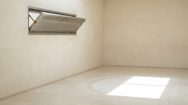 A small municipal atrium after morning cleaning, empty of people, with no rails, ropes, map cabinets, floor drains, ques