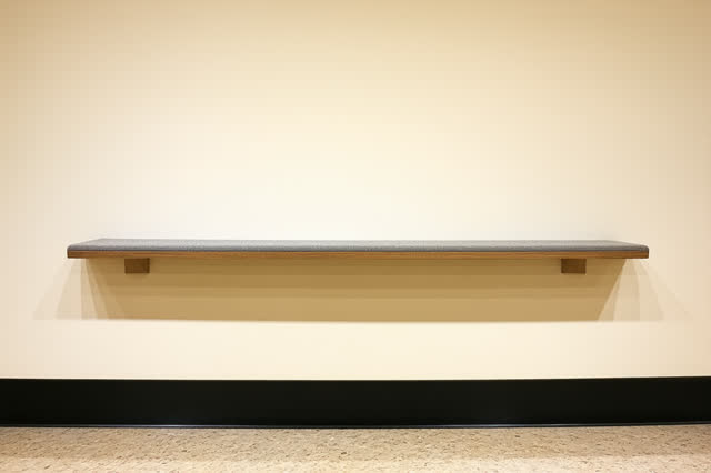 A small clockless workshop corner after hand tools have been put away, empty of people, with no isolated gray block, pot