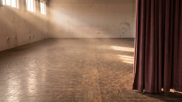 A public rehearsal room after stands and instruments have been removed, empty of people, with no visible instruments, re