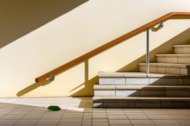 A quiet ramp landing in a public garden pavilion, empty of people, with no readable signs, no shelf of objects, no chair