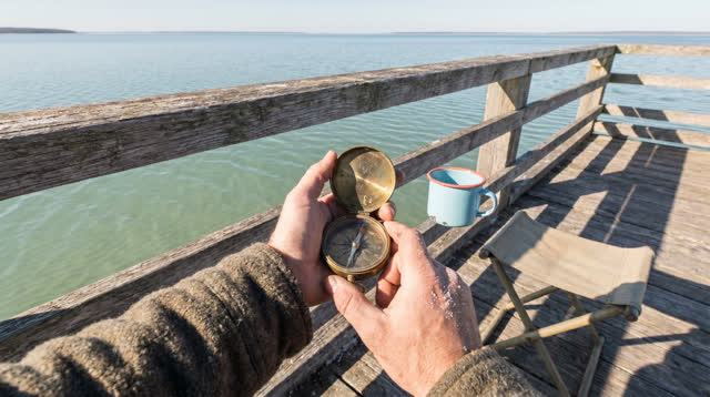 A lucid first-person self-portrait on a broad tidal observation platform above pale water at cold clear morning. One obs