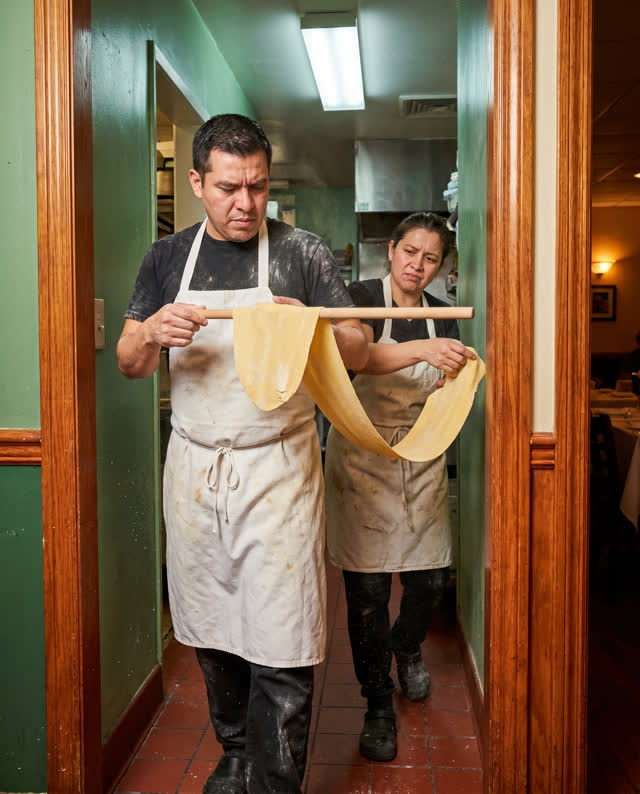 I dream of two cooks trying to carry one exceptionally long sheet of fresh pasta through a narrow restaurant corridor an