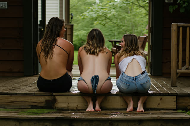 I dream of three adults sitting loosely along the broad lower step of a deep wooden porch after summer rain. Their compl