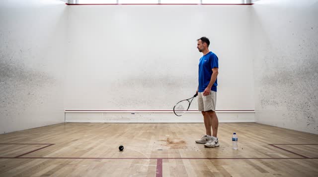 I dream of myself in a quiet squash court after solo practice, lowering the racquet first. I stand off-center with a cal