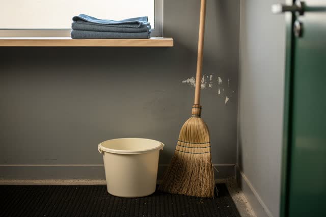 I dream of a quiet municipal supply closet after cleaning is finished. One unlabeled broom leans gently away from an old