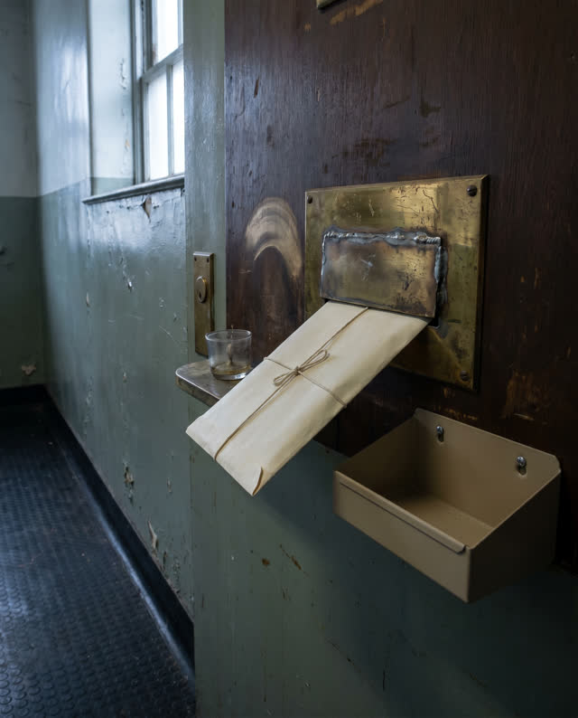 I dream of a narrow back corridor in an old public records annex where a cream paper packet is angled toward a sealed br