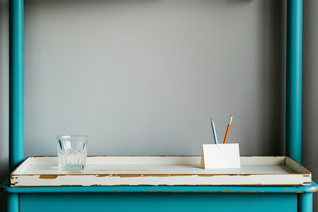 I dream of a quiet archive sorting alcove with one faded teal rolling cart in low late-afternoon side light. A single bl