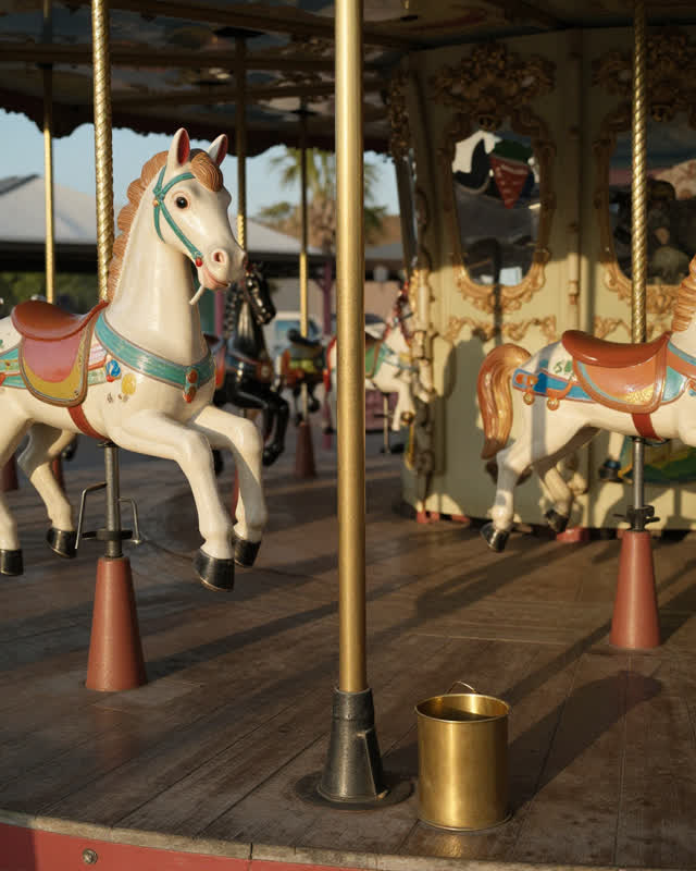 I dream of a municipal park merry-go-round where one brass pole sits slightly lower than the others from decades of heav