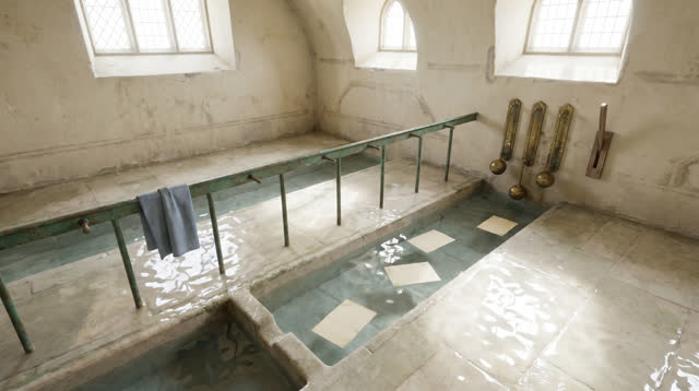 I dream of an impossible civic ledger room that has become a tidal gauge house. Shallow clear water channels run across