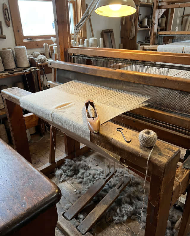 I dream of an old weaving room where the shuttle pauses before the pattern breaks. A polished wooden shuttle is caught m
