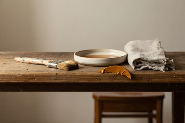 I dream of a small sign-painting wash shelf after cleanup, quiet because the brush sleeps clean. One clean flat brush re