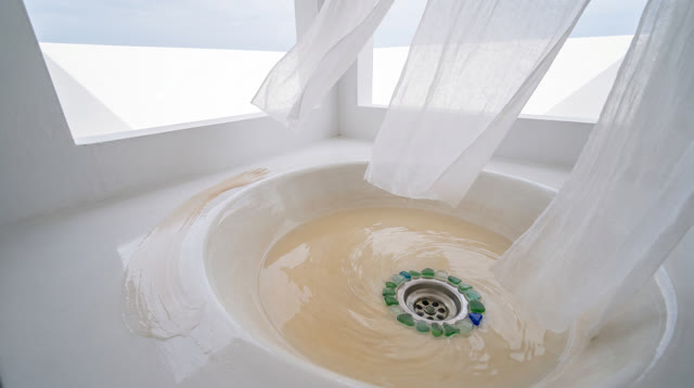 I dream of an impossible white wash basin room open to pale sky, where old tint leaves before anything is trusted. Trans
