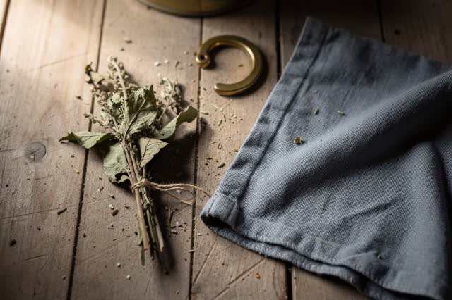 I dream of an apothecary herb drying rack after the damp has left. No jars, bottles, or labels are present: only one sma