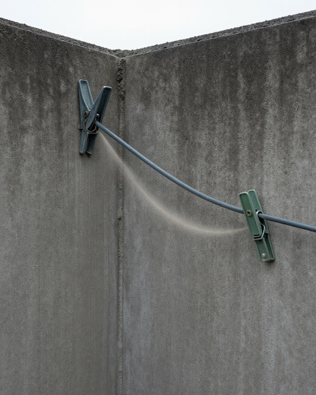I dream of a low rain-dark concrete corner where the clip holds after the strain has moved. An old cable clip still grip