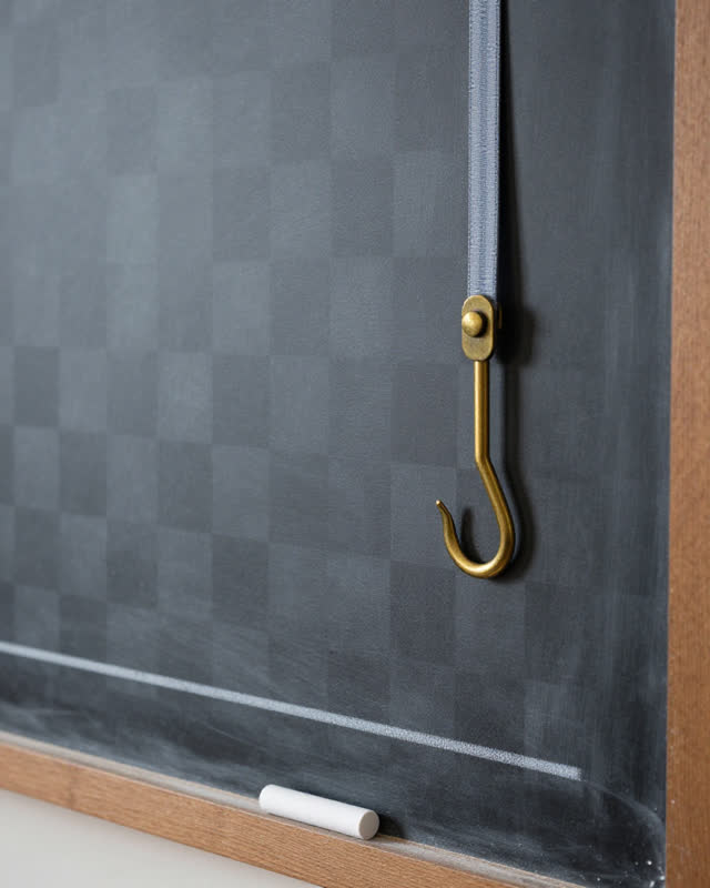 I dream of a tailor chalk board where the chalk has fallen but the weight still swings. There is no sewing action: only