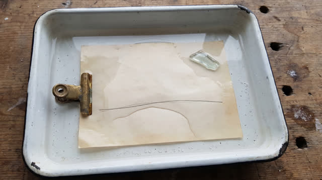 I dream of myself as a cold harbor worktable holding a shallow chipped enamel tray. Inside it, a thin layer of water ben