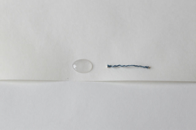 I dream of a cold sill trough with almost nothing on it. One small condensation oval is drying on a strip of aged paper