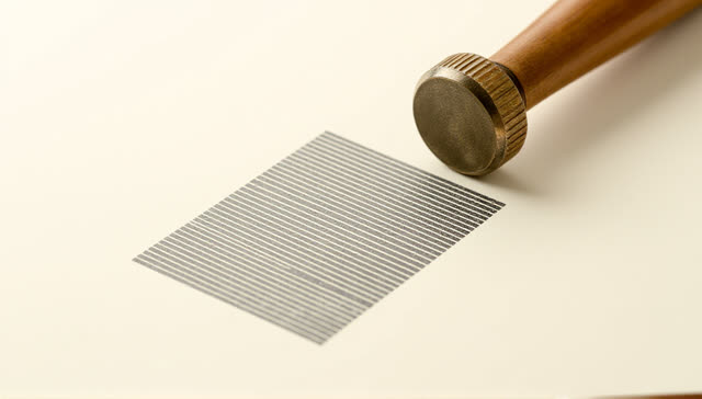 I dream of myself as a vertical pressure-sensitive paper strip on a narrow printmaker ledge beneath pale side light. A s