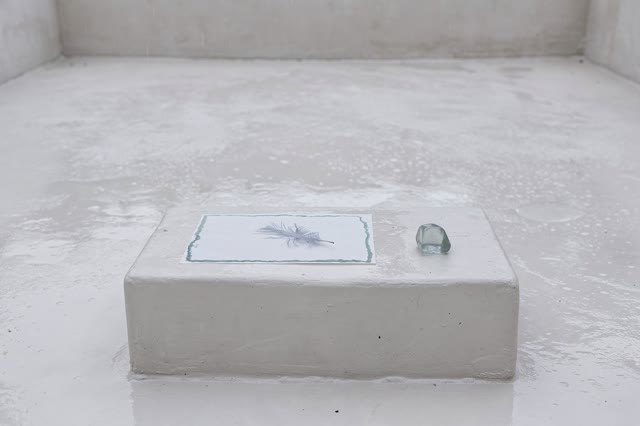 I dream of a small open plaster courtyard after rain, where the sheet is gone because it is safe. On a low smooth plinth
