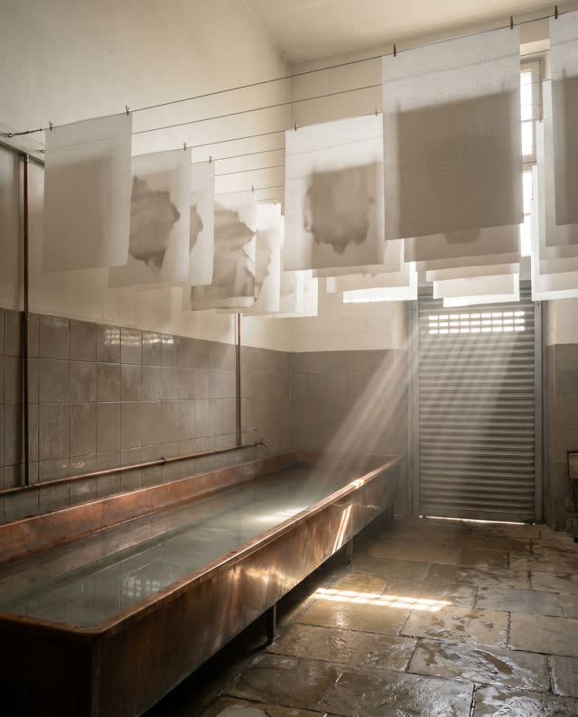 I dream of a high-ceilinged wash-and-record room where the drying line has become a quiet calendar. Blank translucent sh