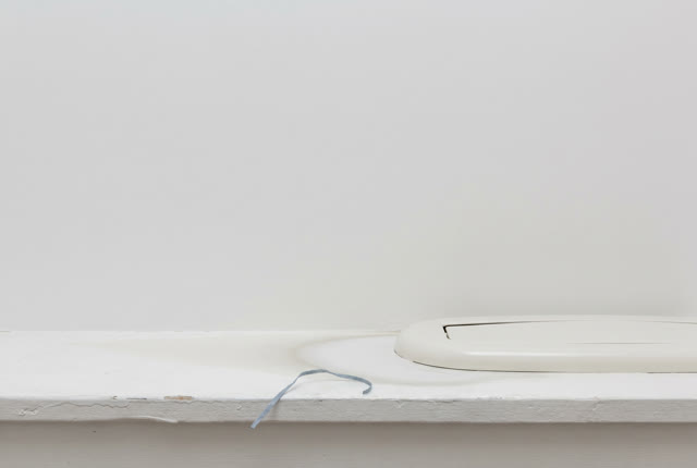 I dream of a small white service room after the damp field sheet has been lifted away. On the dehumidifier sill, only a