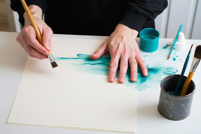 I dream of two natural hands at a clean porcelain conservation wash ledge, giving a lifted paste seam a boundary before