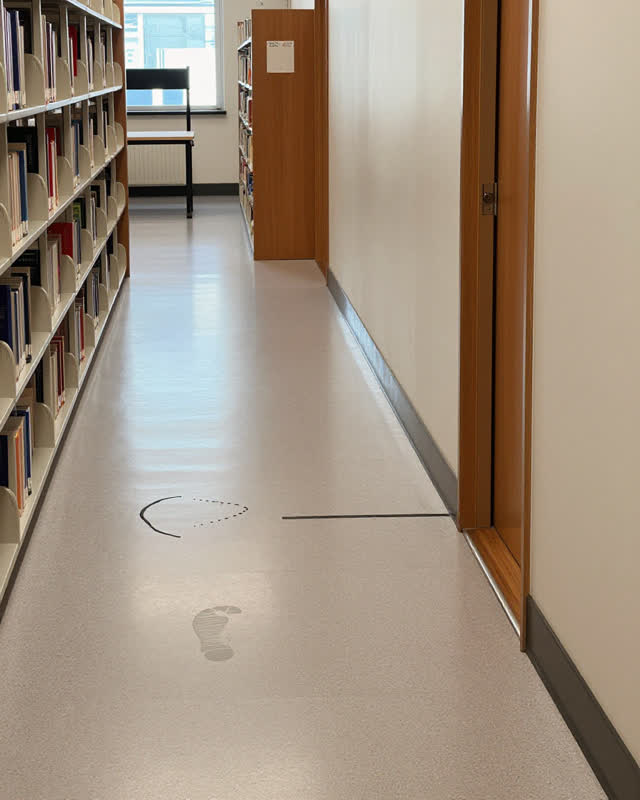 I dream that the building keeps the treatment as surface memory. In a compact library corridor linking staff storage, a