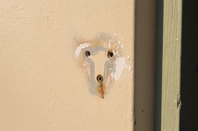 I dream that the wall keeps the bracket's outline. On a quiet covered porch at a public craft classroom after closing, a