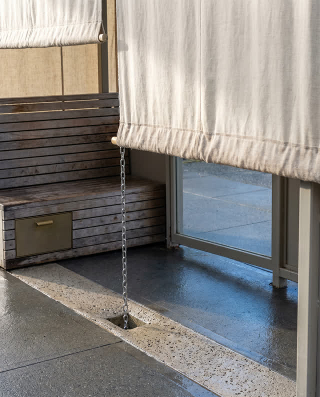 I dream that the shelter sorts sun, rain, and footsteps. In a compact neighborhood transit shelter, a linen canopy, timb