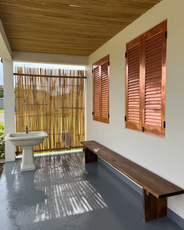 I dream that the porch tunes shade, water, and work together. On a semi-open civic service porch, reed shade ribs, a pla