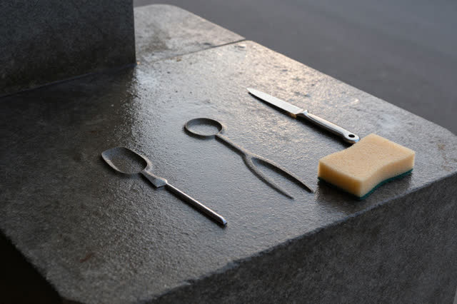 I dream that the tools dry where they rested. On a shaded municipal tool-wash stone beside a maintenance yard, with no b
