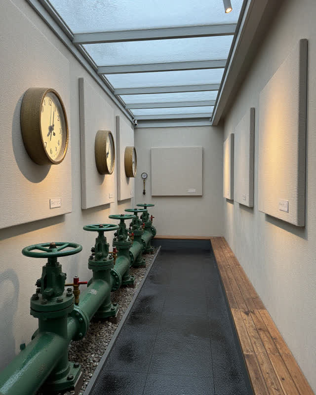 I dream that the waterworks keeps time by sound and pressure. In a working public waterworks annex, green pump valves, s