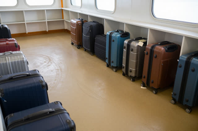 I dream that I let the luggage scuffs rest. In a ferry baggage room after the morning rush, curved suitcase scuffs on ru